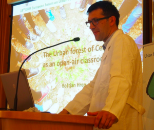 My talk emphasized how the champions of urban forests are really frontline health workers, so I was thrilled when, the following day, urban foresters chose to don white medical coats for their address - to claim the place of urban forests in our health care system. Image: Boštjan Hren